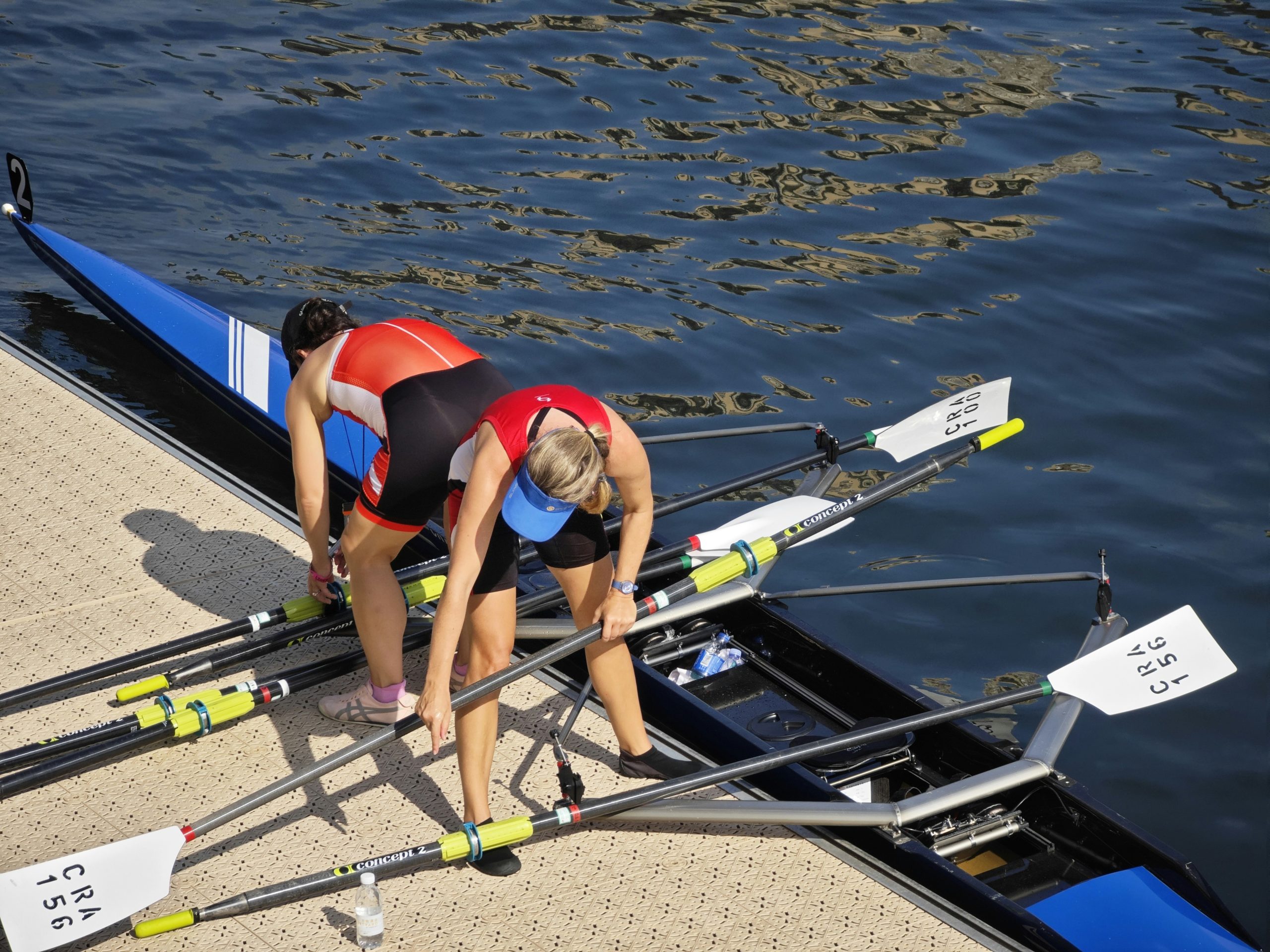 Close up of a rowing machine monitor showing vigorous stats in a gym environment