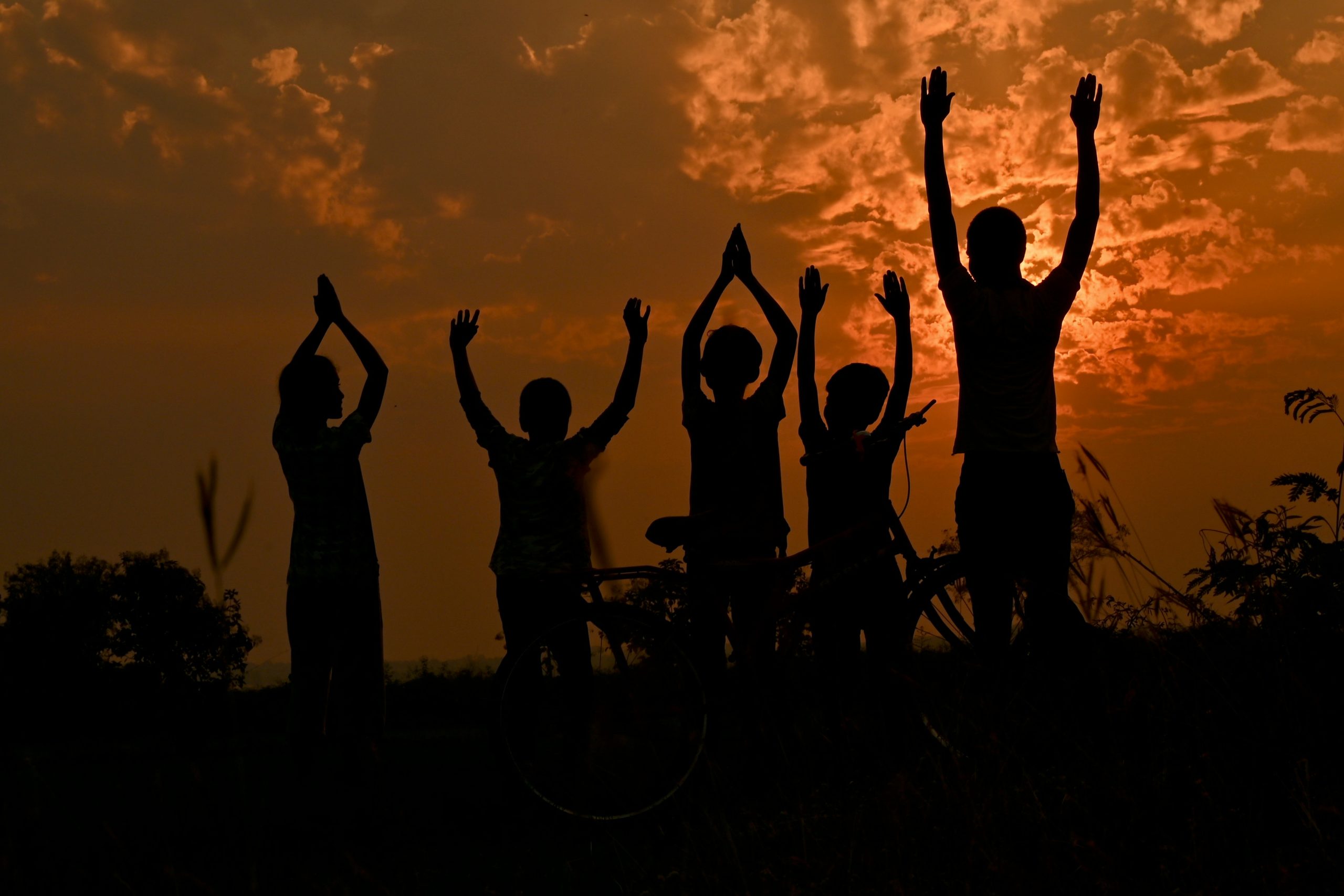 Diverse group of people high-fiving after a workout session