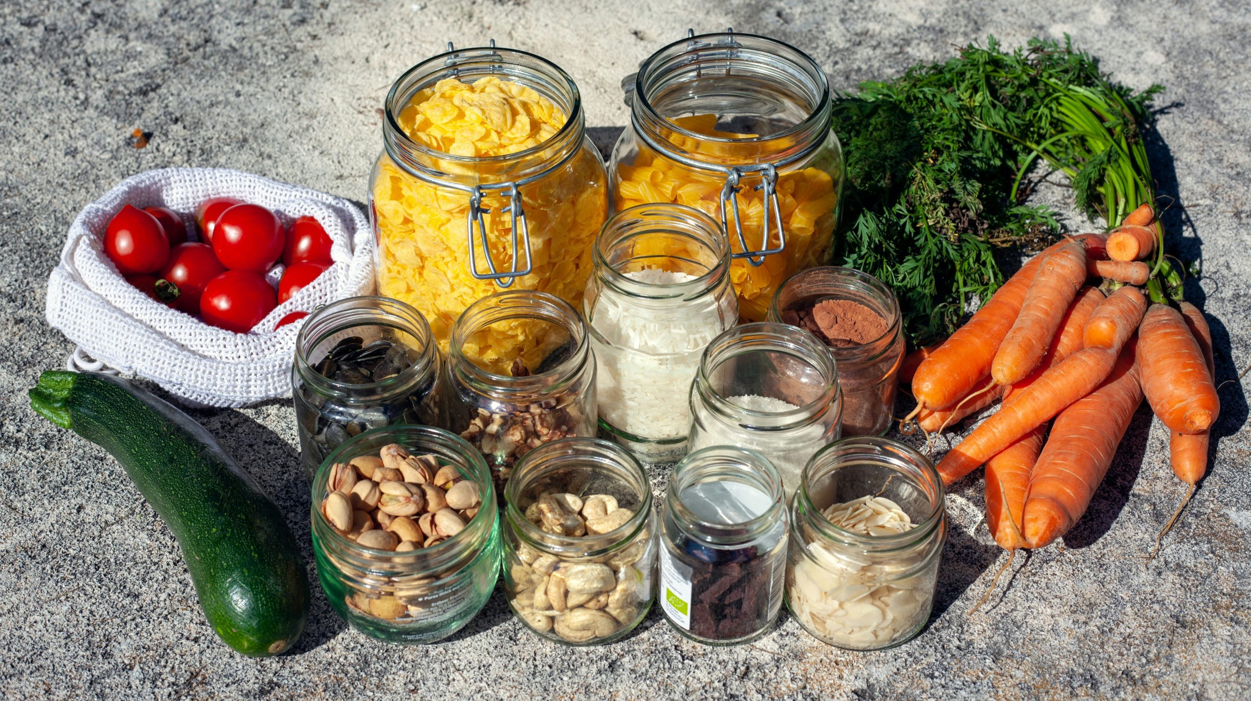 High quality photo of healthy meal prep containers with vegetables, lean protein and complex carbs on a kitchen counter