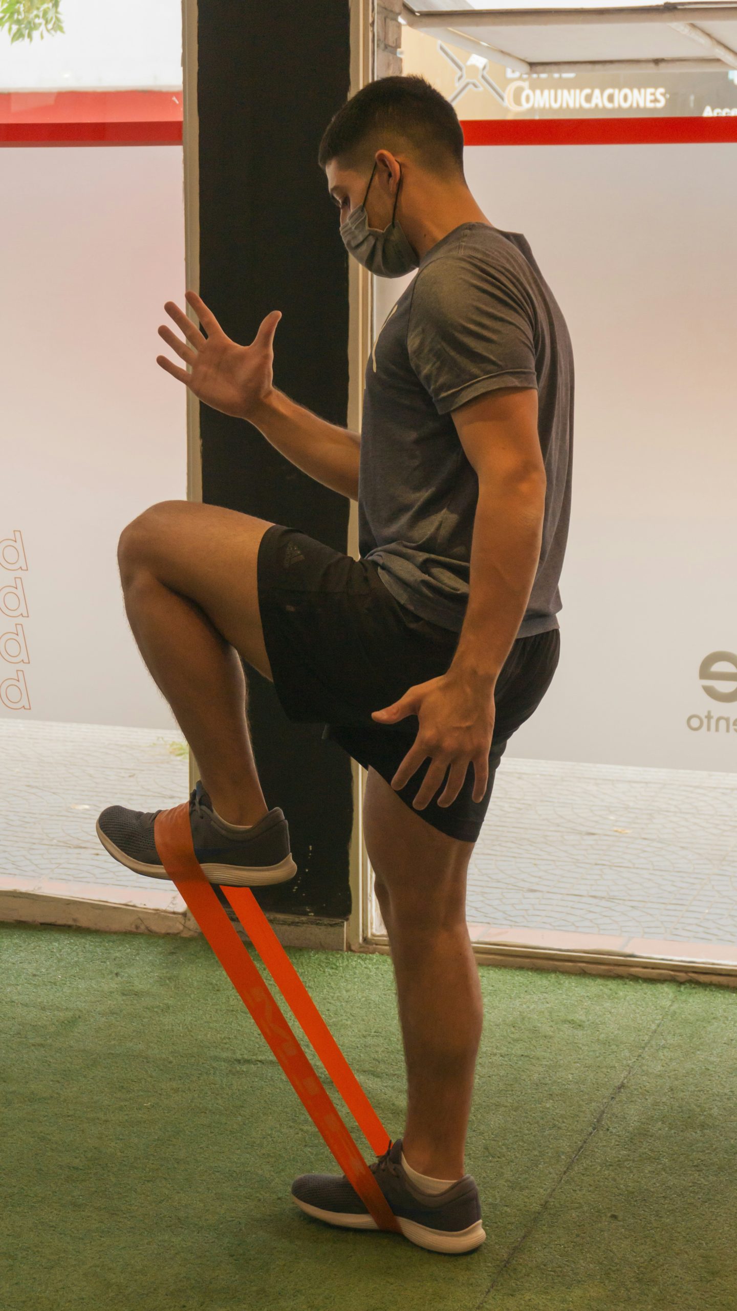 Athlete performing a single leg squat or pistol squat on a box highlighting balance and knee alignment